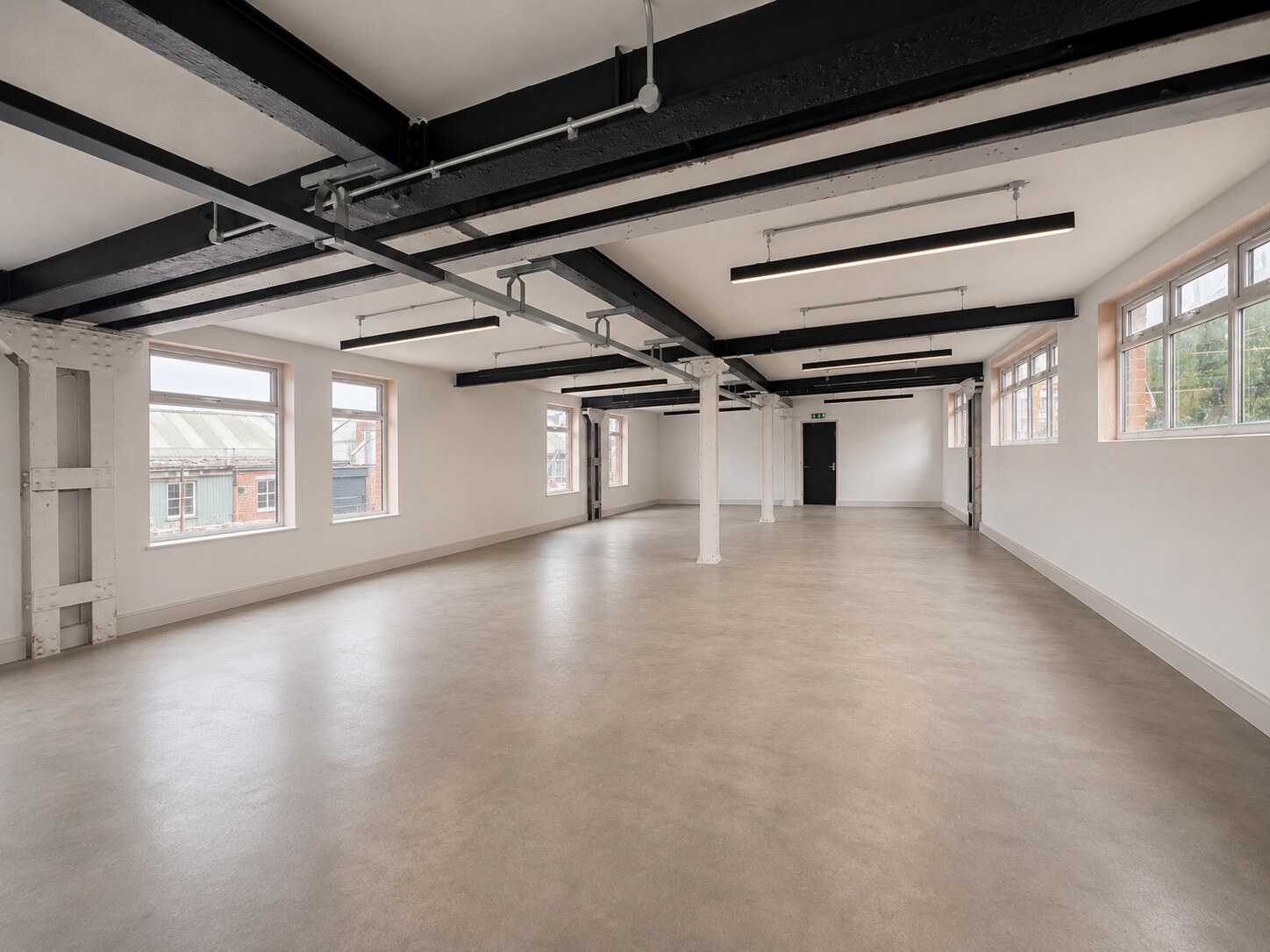Large open commercial unit with original iron columns